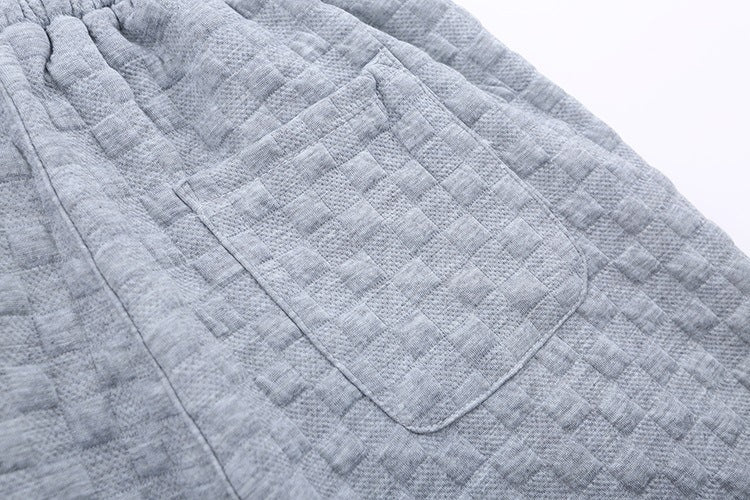 Løstsiddende ternede strikbukser