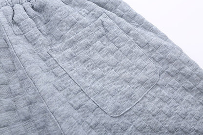 Løstsiddende ternede strikbukser