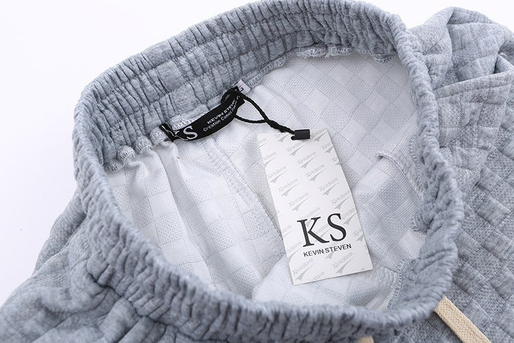 Løstsiddende ternede strikbukser