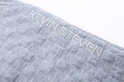 Løstsiddende ternede strikbukser