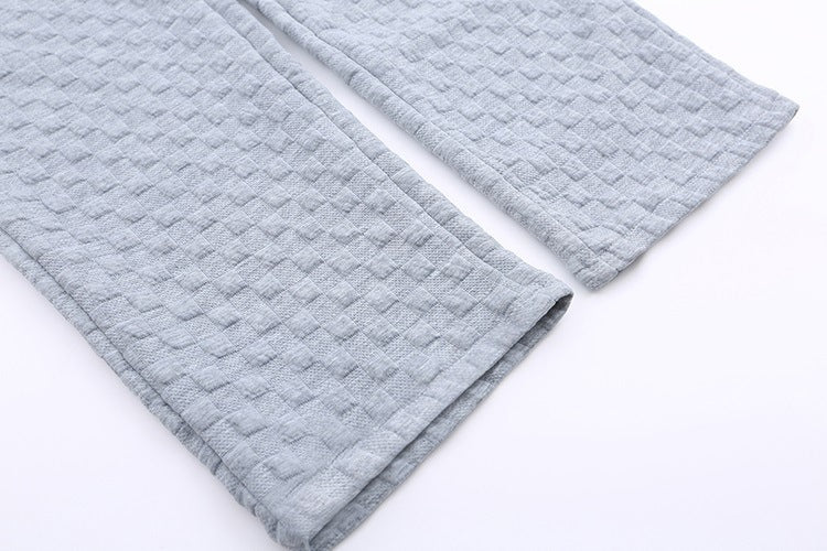 Løstsiddende ternede strikbukser