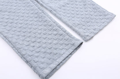 Løstsiddende ternede strikbukser